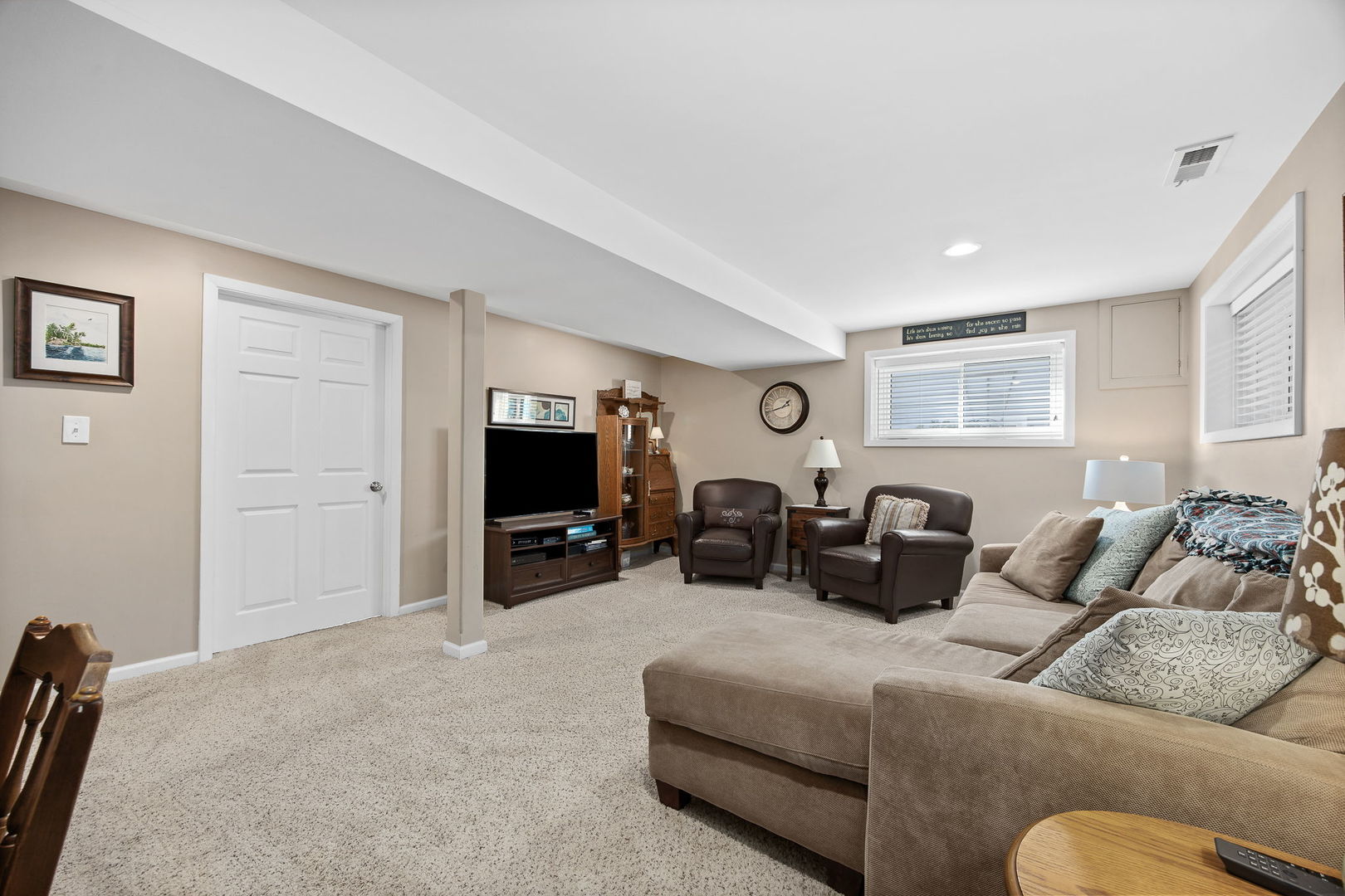 723 Inverness Road Lisle, IL 60532 - Photo 21 of 40 a living room with furniture and a flat screen tv