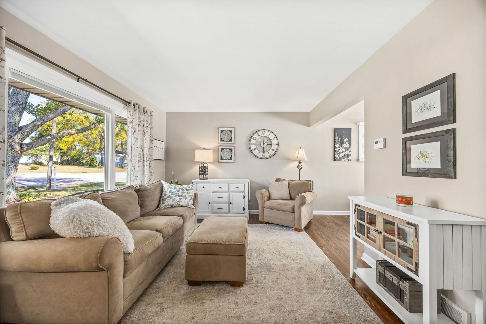 723 Inverness Road Lisle, IL 60532 - Photo 5 of 40 a living room with furniture and a large window