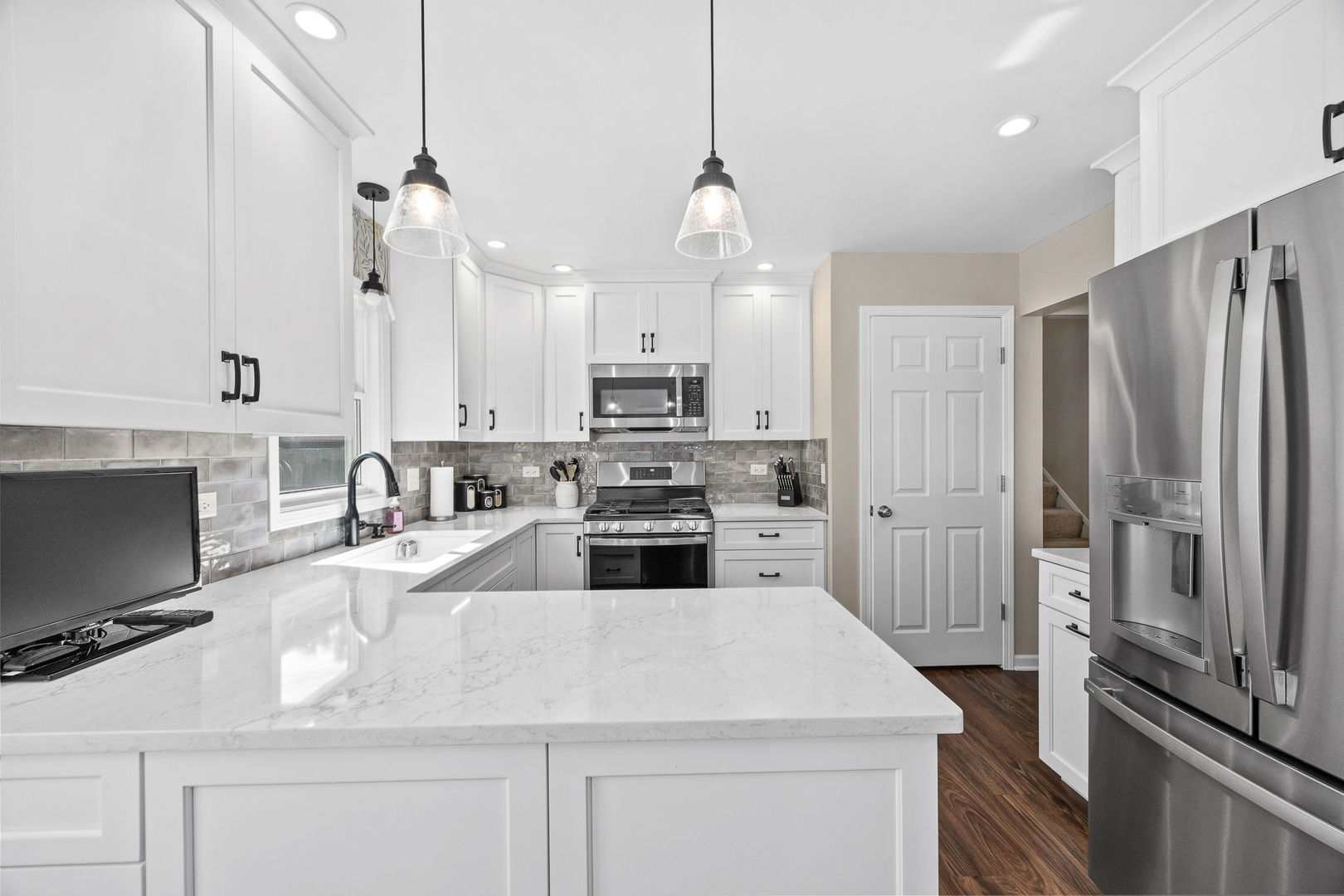 723 Inverness Road Lisle, IL 60532 - Photo 9 of 40 a kitchen with kitchen island a counter top space stainless steel appliances and cabinets