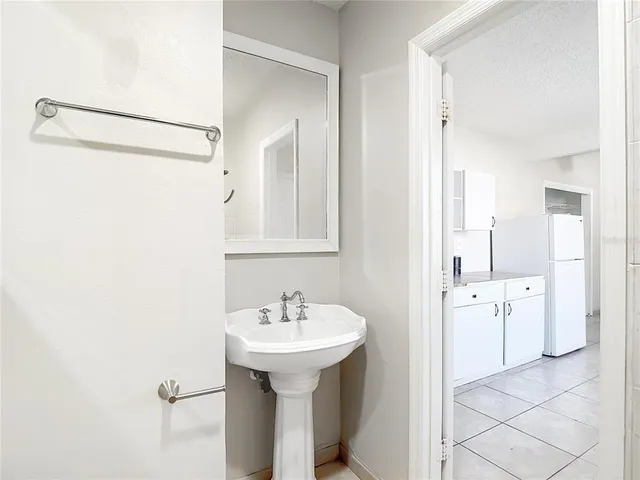 a bathroom with a sink and mirror