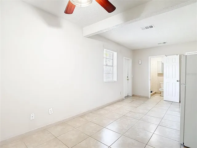 a view of an empty room with a window