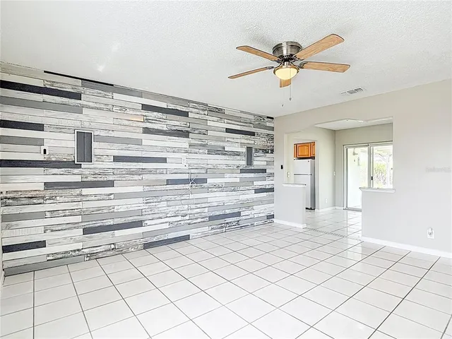 a view of room with window and ceiling fan