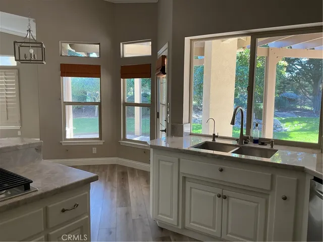 a kitchen with a sink and large window