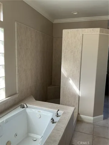 a bathroom with a tub and sink