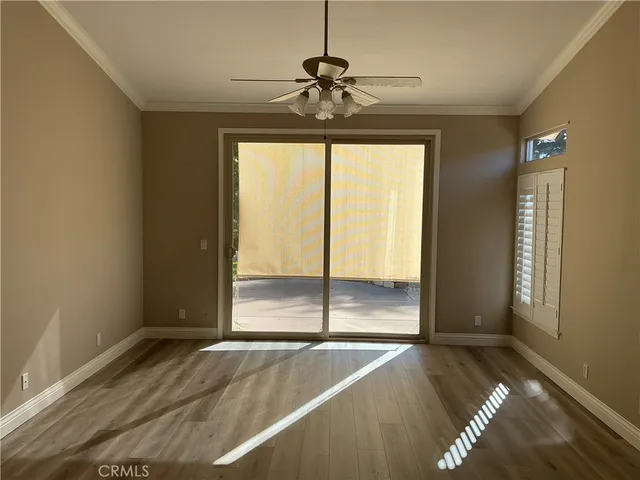 a view of a livingroom with a furniture window and wooden floor