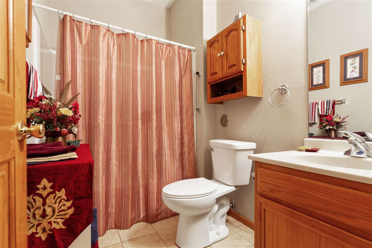 10181 Monarch Road, Unit 3 Roscoe, IL 61073 - Photo 13 of 15 a bathroom with a toilet a sink and a mirror