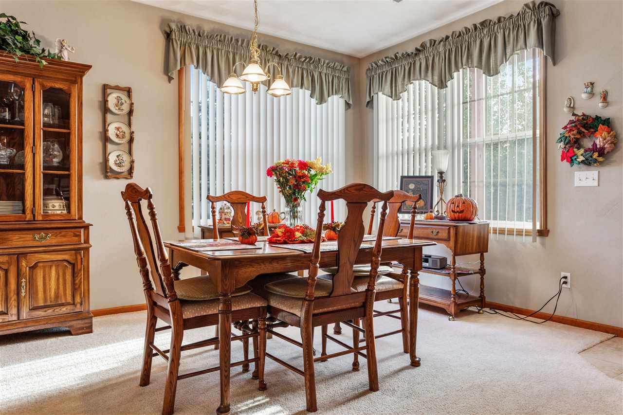 10181 Monarch Road, Unit 3 Roscoe, IL 61073 - Photo 8 of 15 a dining room with furniture and window