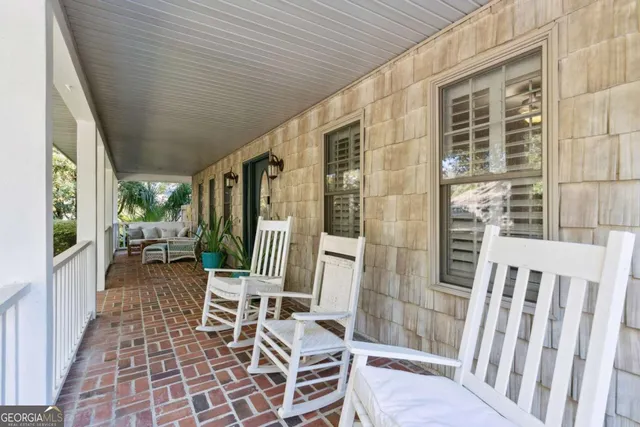 a porch with outdoor seating