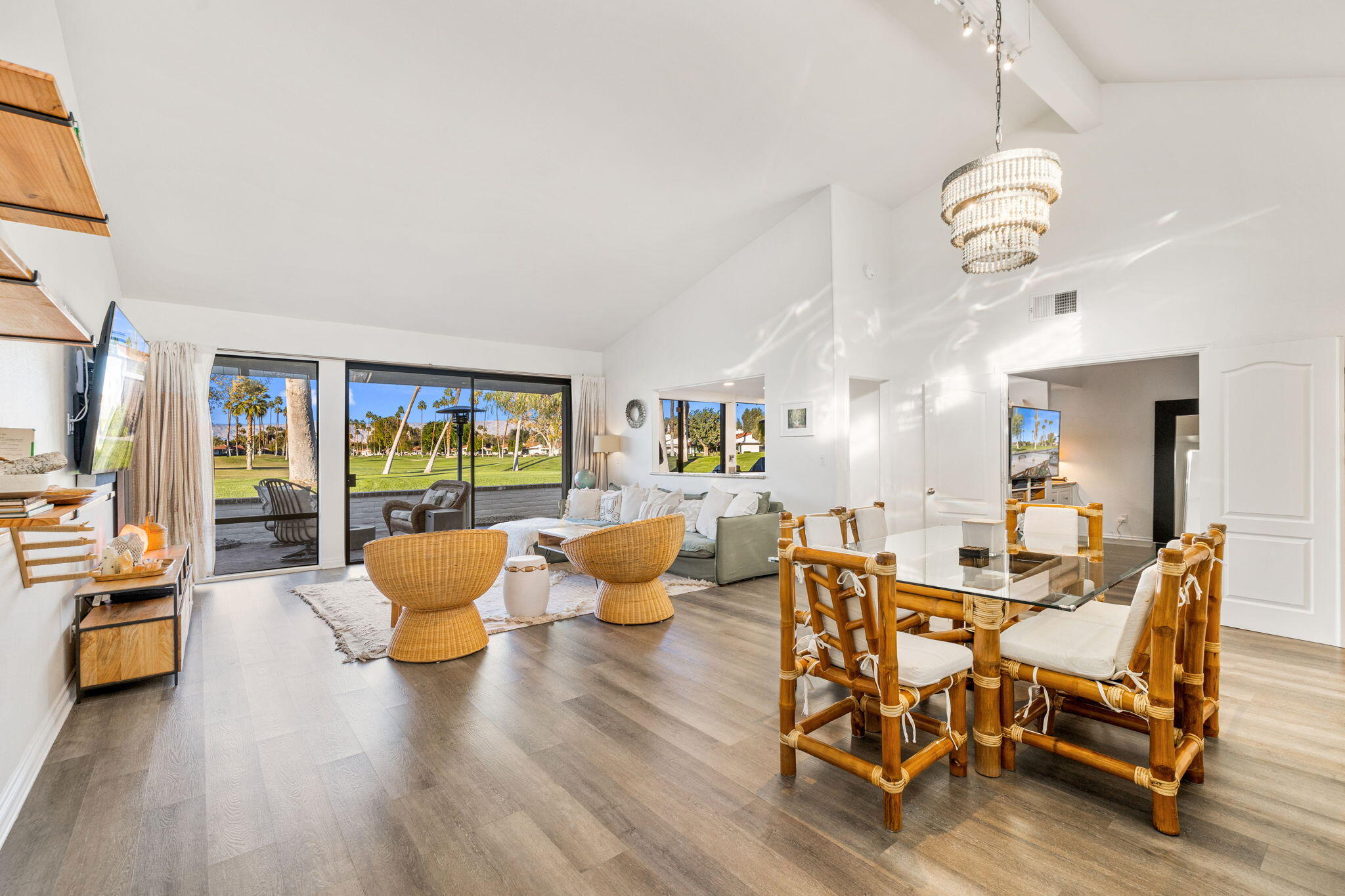 a living room with furniture and wooden floor