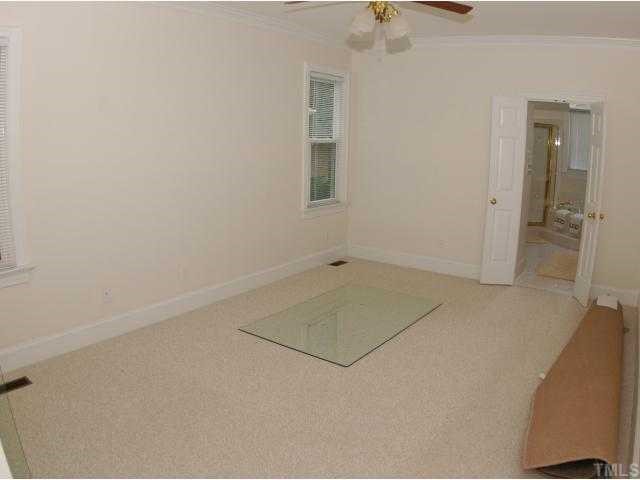 2992 Tillinghast Trail Raleigh, NC 27613 - Photo 7 of 12 an empty room with a bathroom