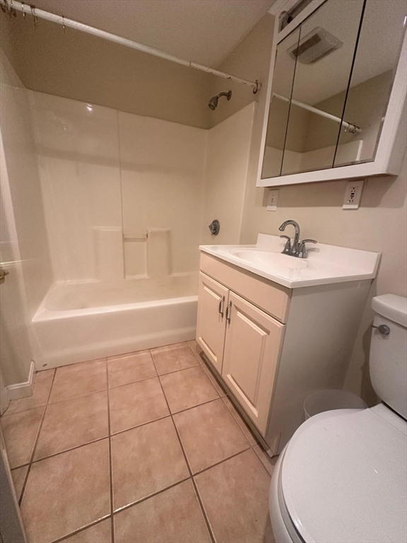 136 Ferry Street, Unit 2 Grafton, MA 01560 - Photo 11 of 29 a bathroom with a sink a toilet and bathtub