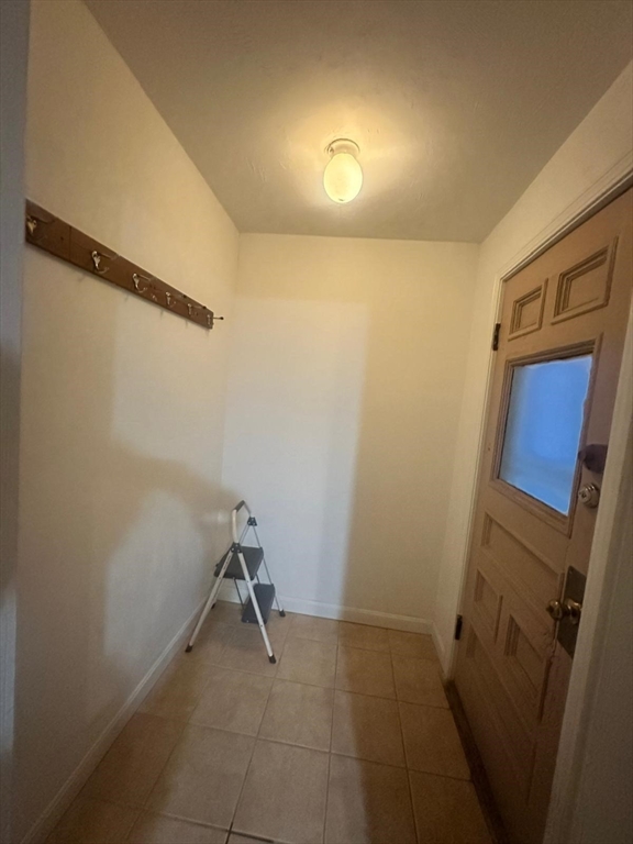 136 Ferry Street, Unit 2 Grafton, MA 01560 - Photo 12 of 29 a view of a room with rack on the wall