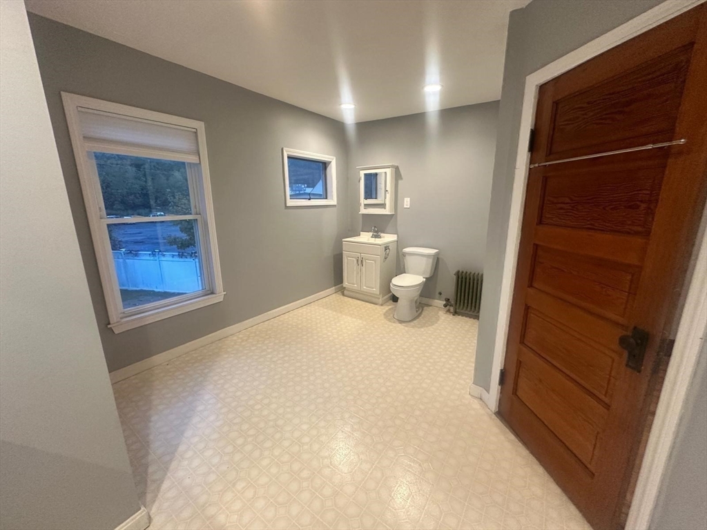 136 Ferry Street, Unit 2 Grafton, MA 01560 - Photo 20 of 29 a bedroom with a bed and a window