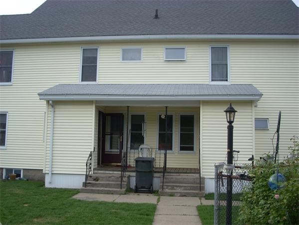136 Ferry Street, Unit 2 Grafton, MA 01560 - Photo 29 of 29 a front view of a house with garden