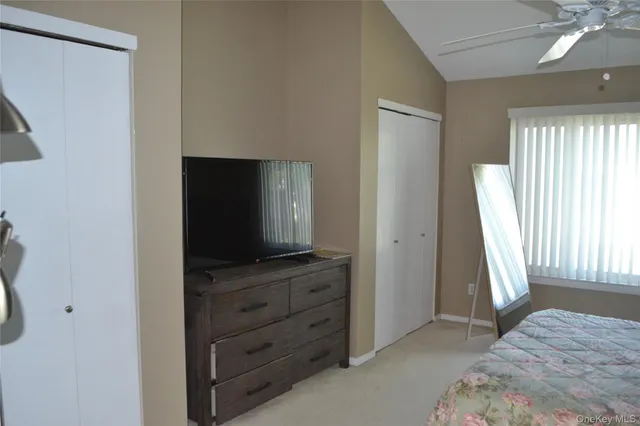 a living room with furniture and flat screen tv
