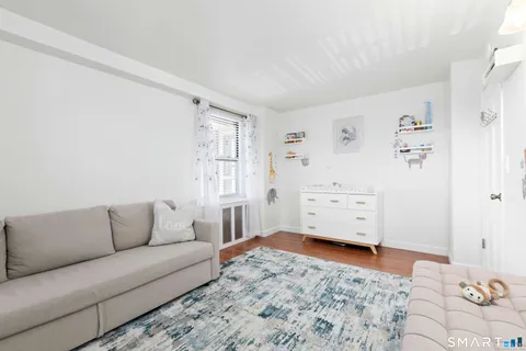 a living room with furniture and a gate