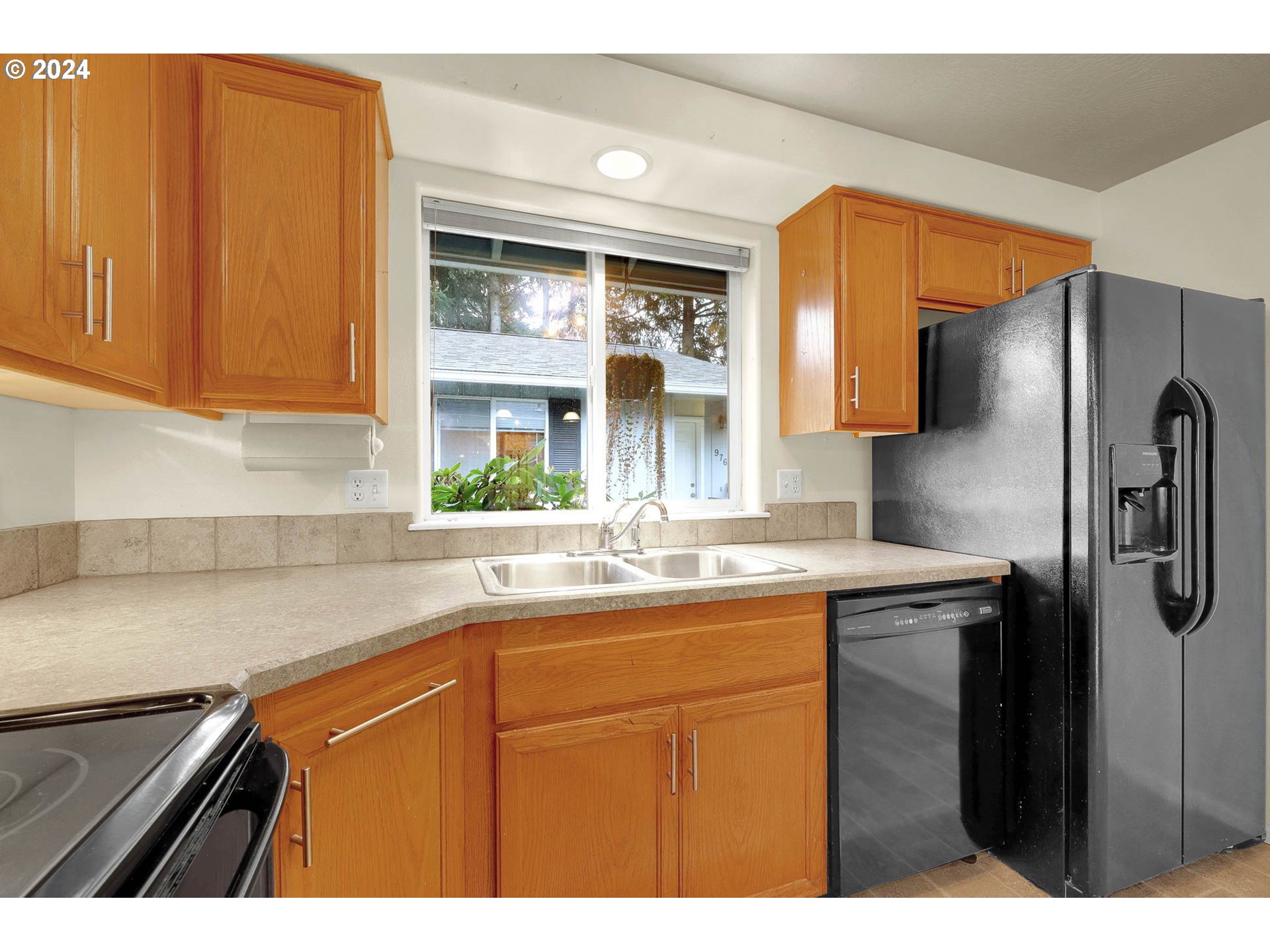 972 West L Street Springfield, OR 97477 - Photo 11 of 27 a kitchen with a sink and cabinets