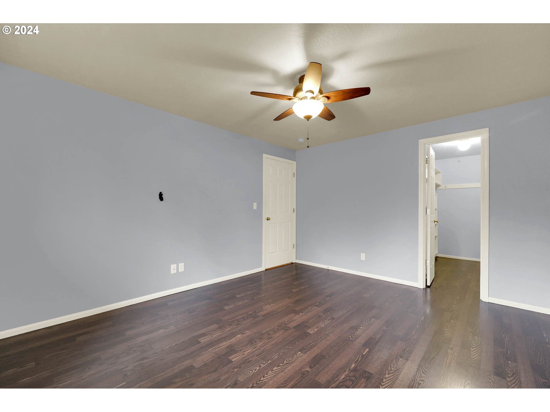 972 West L Street Springfield, OR 97477 - Photo 17 of 27 a view of an empty room with wooden floor