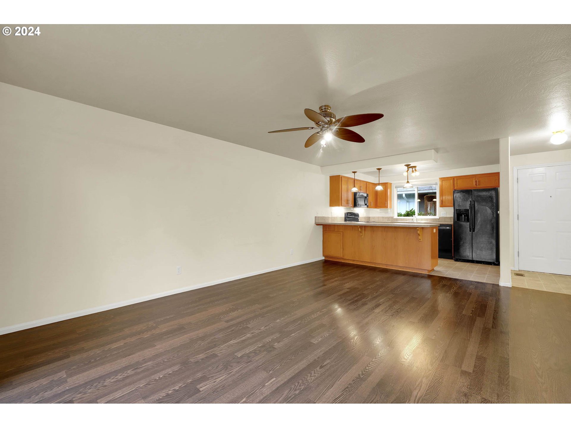 972 West L Street Springfield, OR 97477 - Photo 8 of 27 a view of a kitchen with a wooden floor