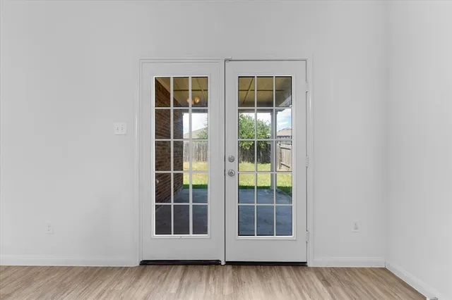 a white toilet sitting next to a shower