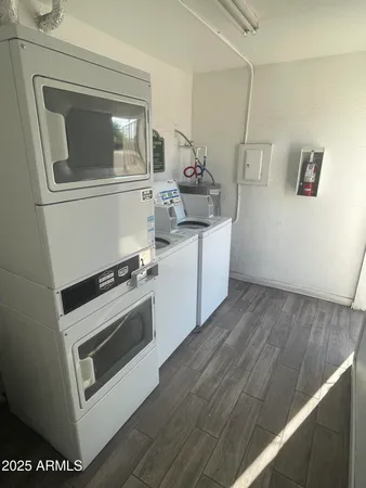 a kitchen with a stove and a white wooden cabinets