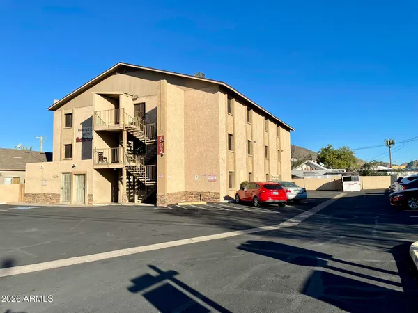 a view of a street with cars on road