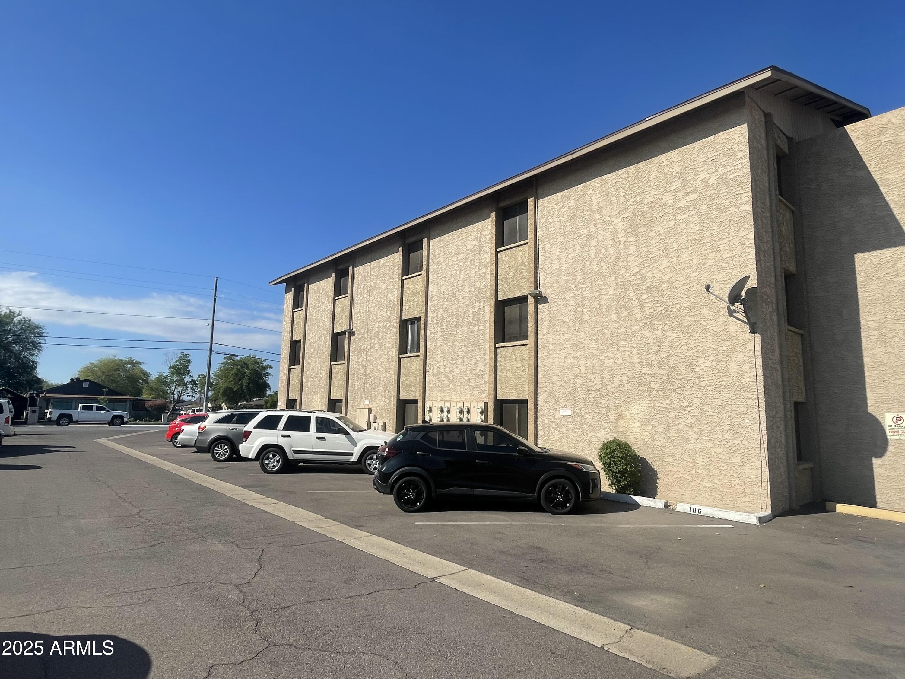 602 East Townley Avenue, Unit 305 Phoenix, AZ 85020 - Photo 19 of 21 a car parked in front of a building