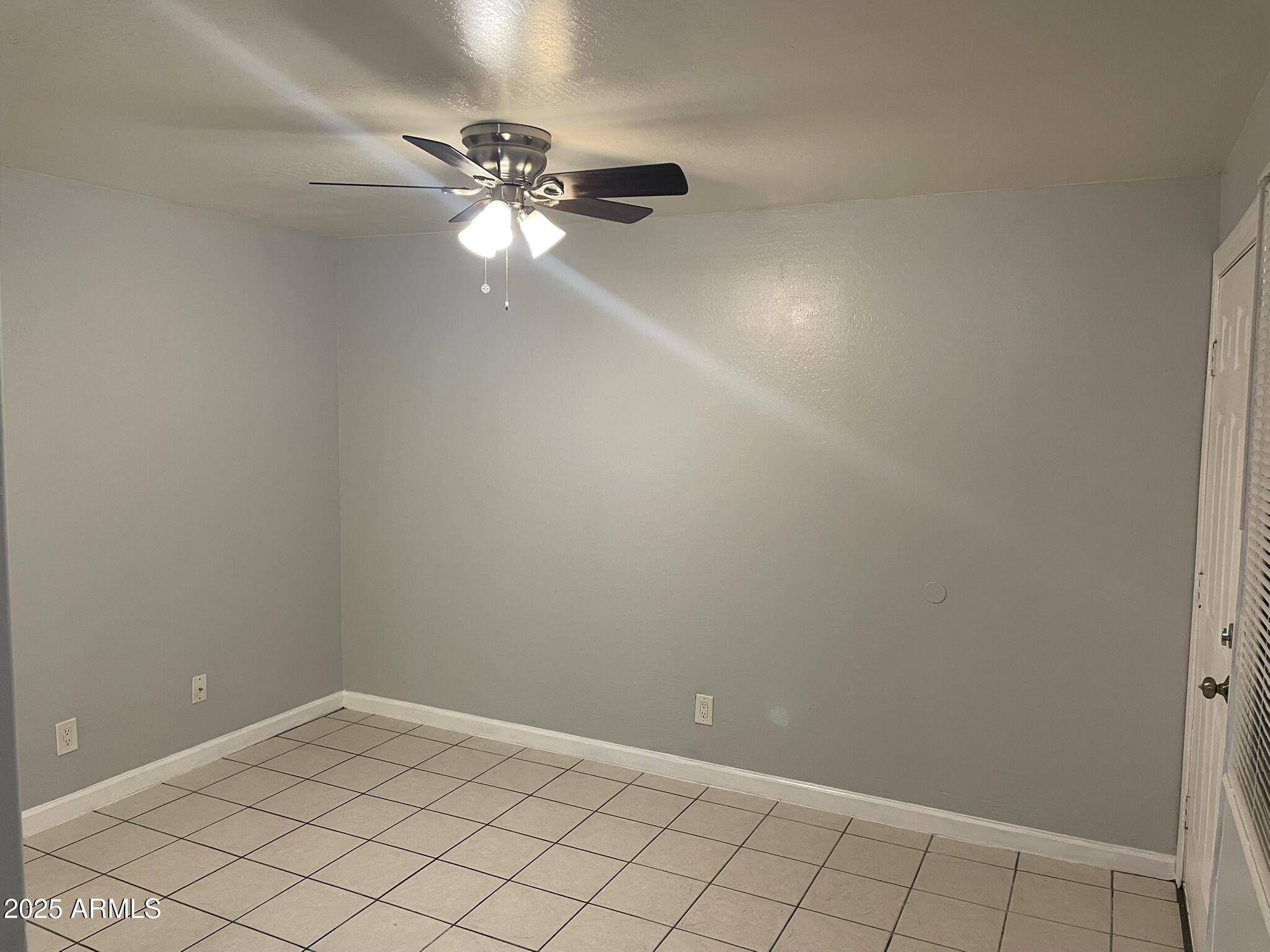 602 East Townley Avenue, Unit 305 Phoenix, AZ 85020 - Photo 3 of 21 a view of an empty room and window
