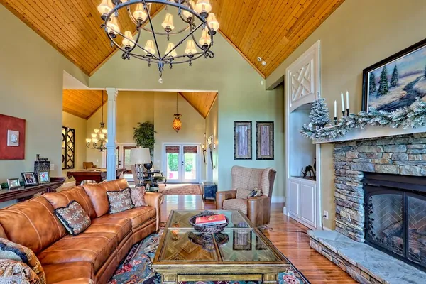 a bedroom with a bed a flat screen tv and balcony view