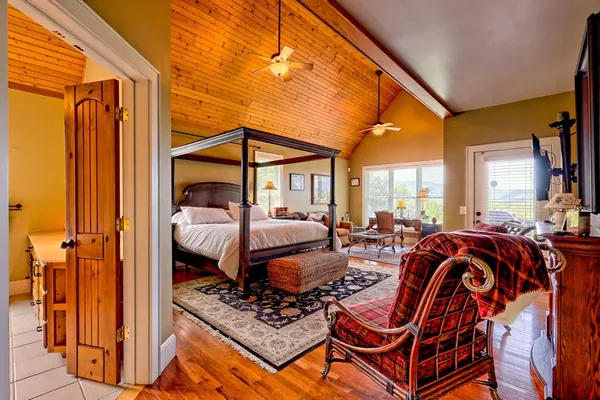 a bathroom with a glass shower door and a sink