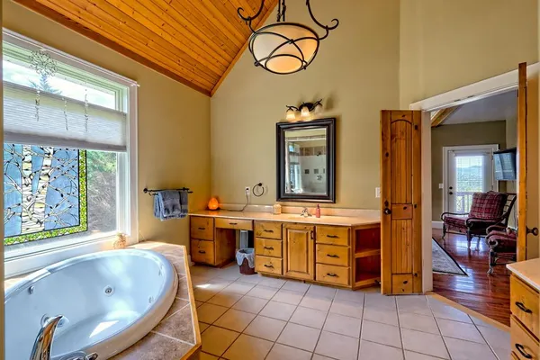 a bedroom with a bed and a table in it
