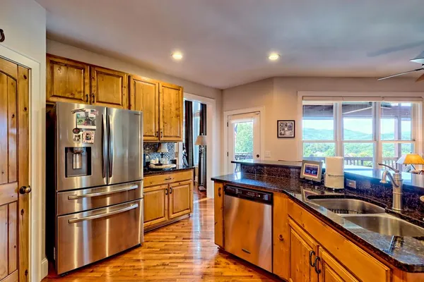 a view of bathroom with a toilet and a window