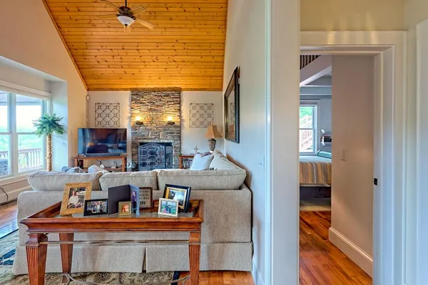 a living room with furniture and a flat screen tv
