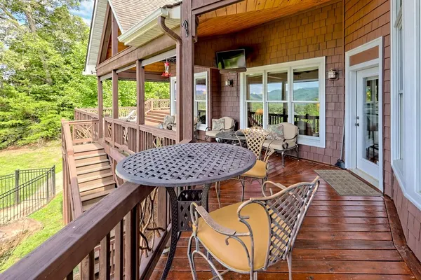 a view of a house with patio and a yard