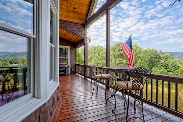 an aerial view of a house with swimming pool garden and patio