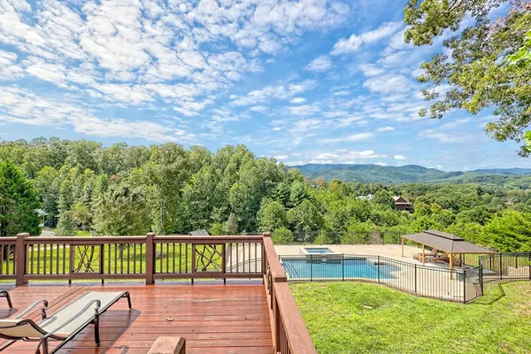 a view of a swimming pool with a patio