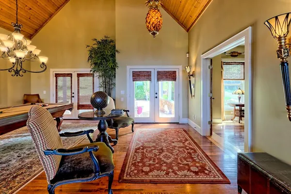 a living room with furniture fireplace and window