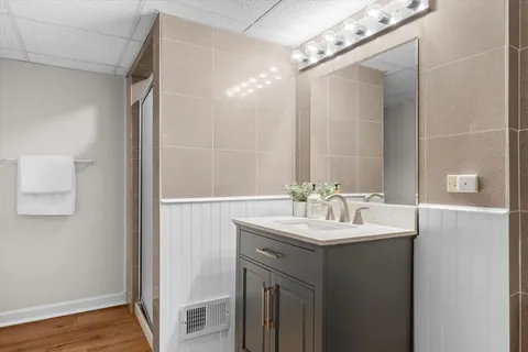 a bathroom with a sink and a mirror