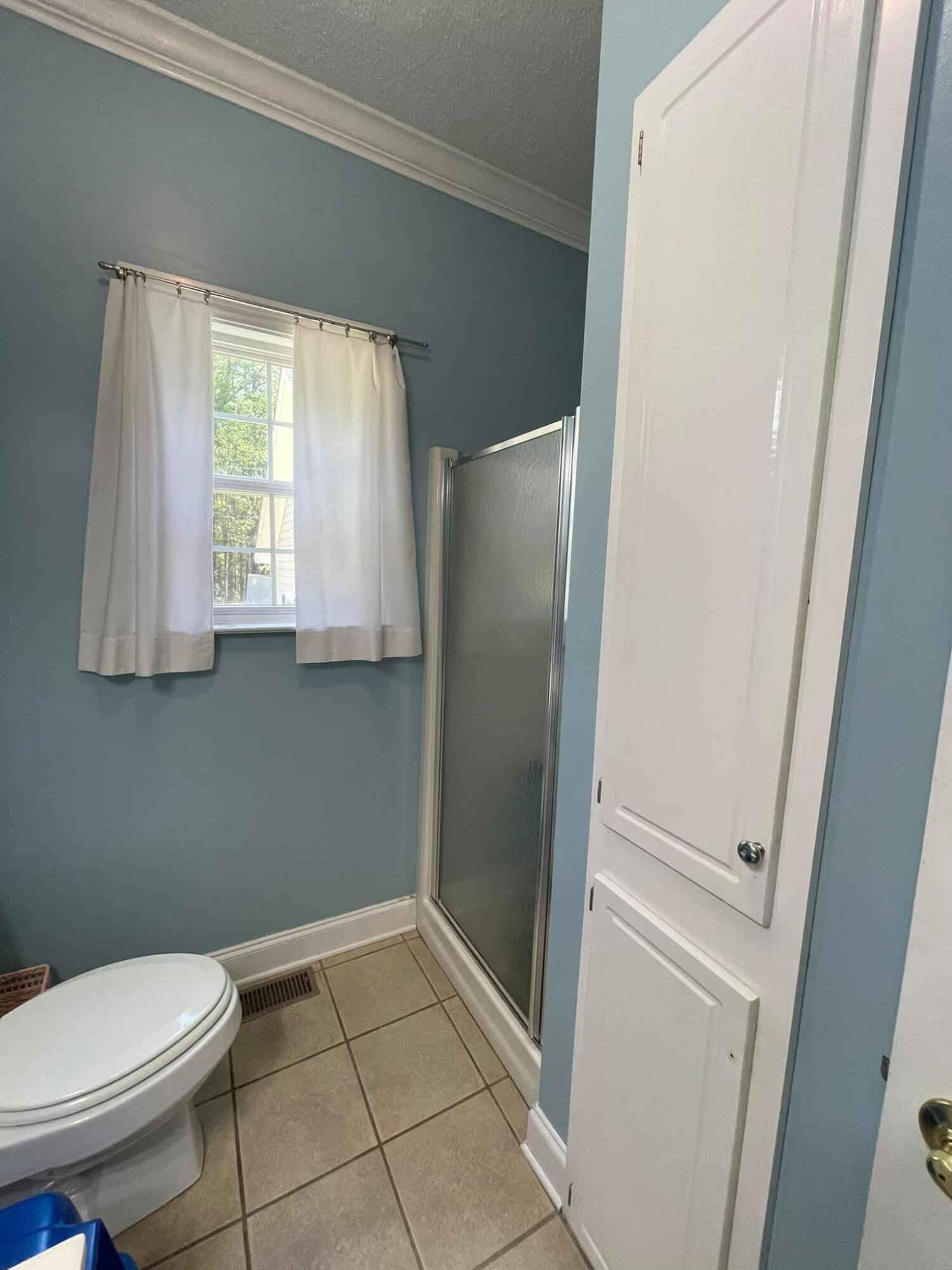 21127 Benvalen Road Andalusia, AL 36420 - Photo 12 of 36 a bathroom with a toilet and a shower