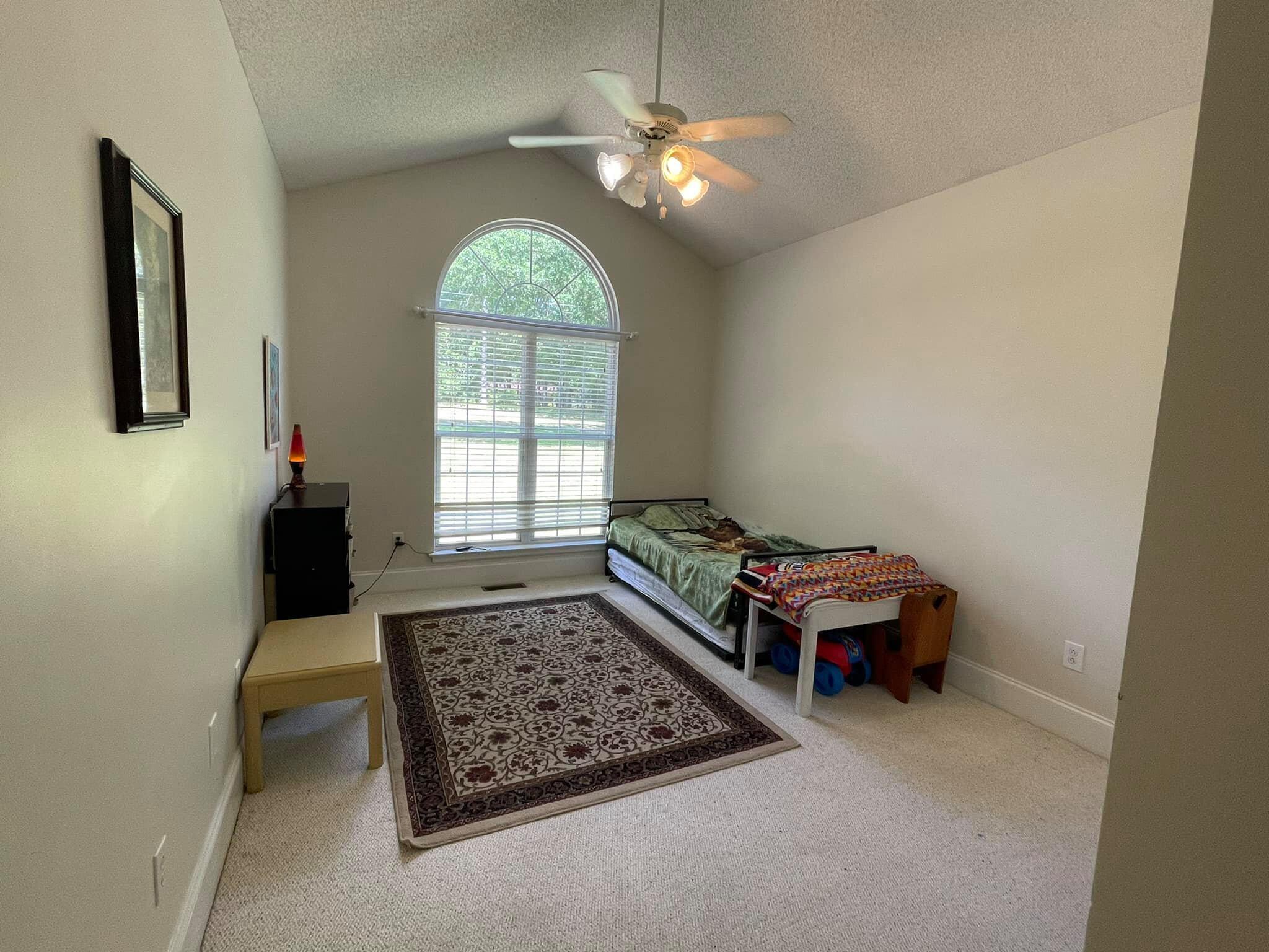 21127 Benvalen Road Andalusia, AL 36420 - Photo 15 of 36 an empty room with windows and ceiling fan