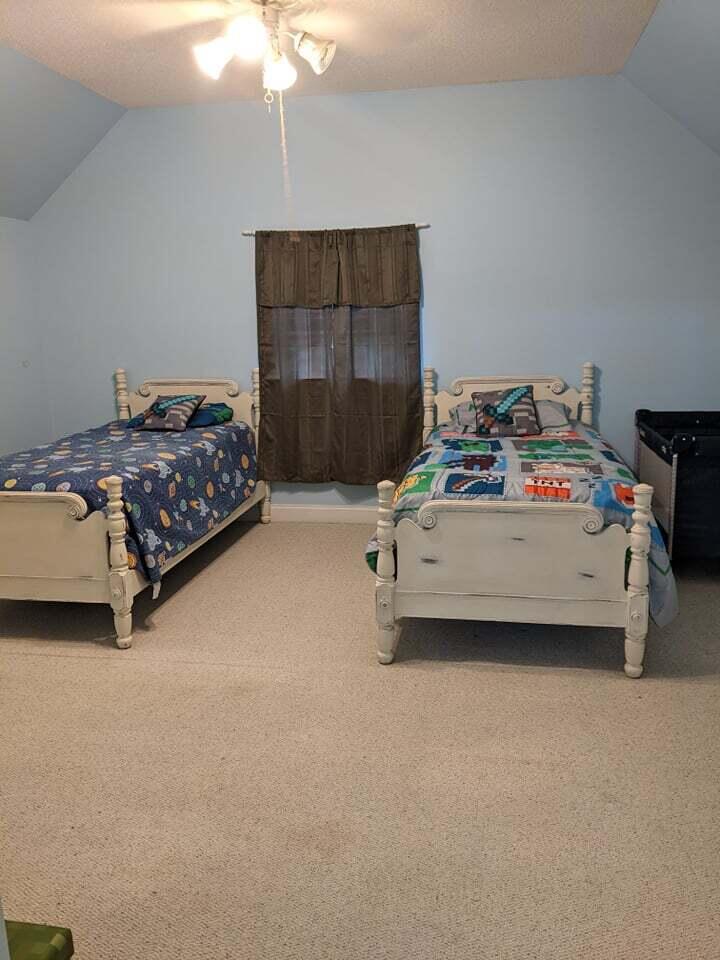 21127 Benvalen Road Andalusia, AL 36420 - Photo 25 of 36 a bedroom with a bed and a chandelier
