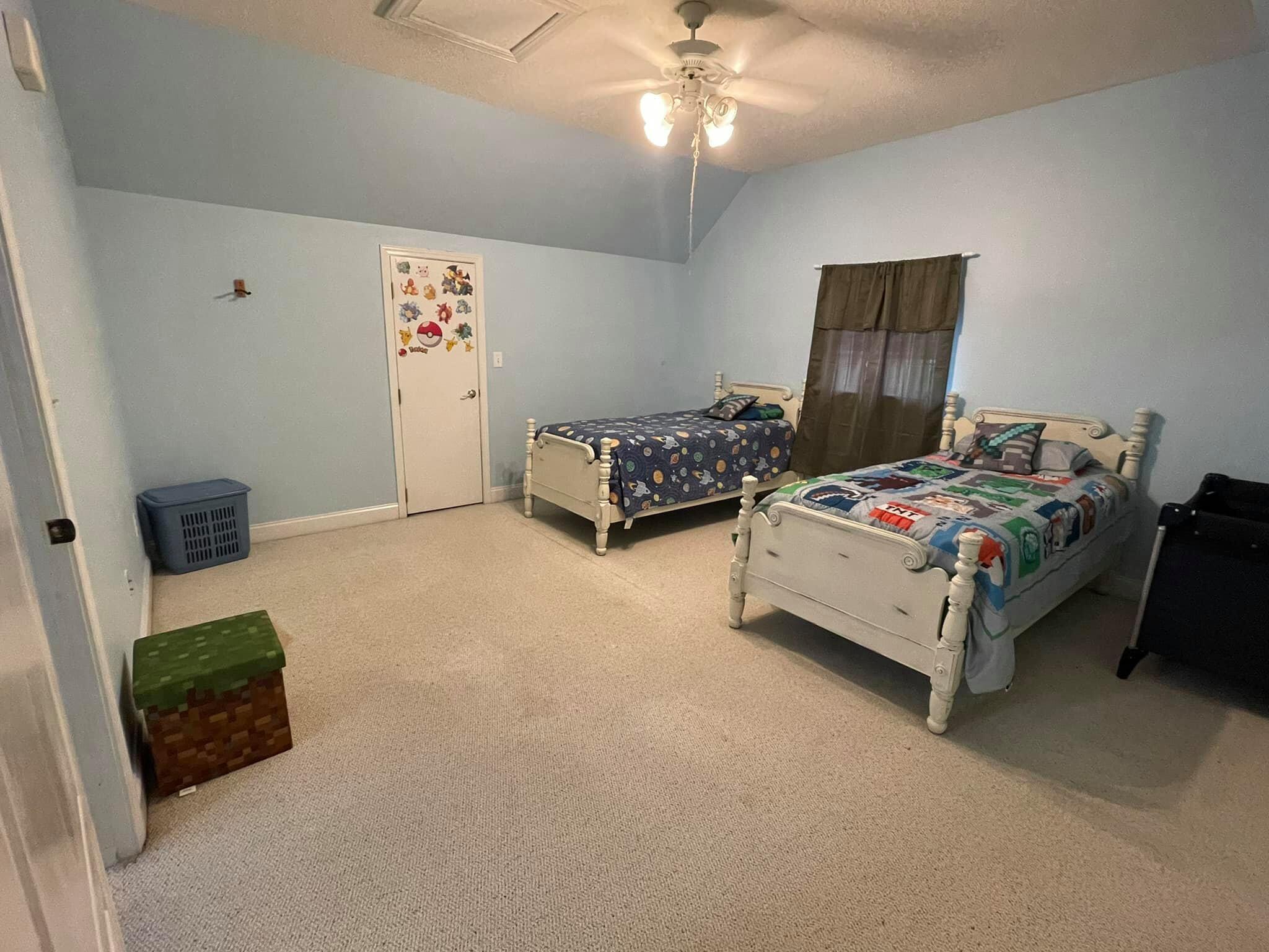 21127 Benvalen Road Andalusia, AL 36420 - Photo 26 of 36 a bedroom with furniture and a flat screen tv