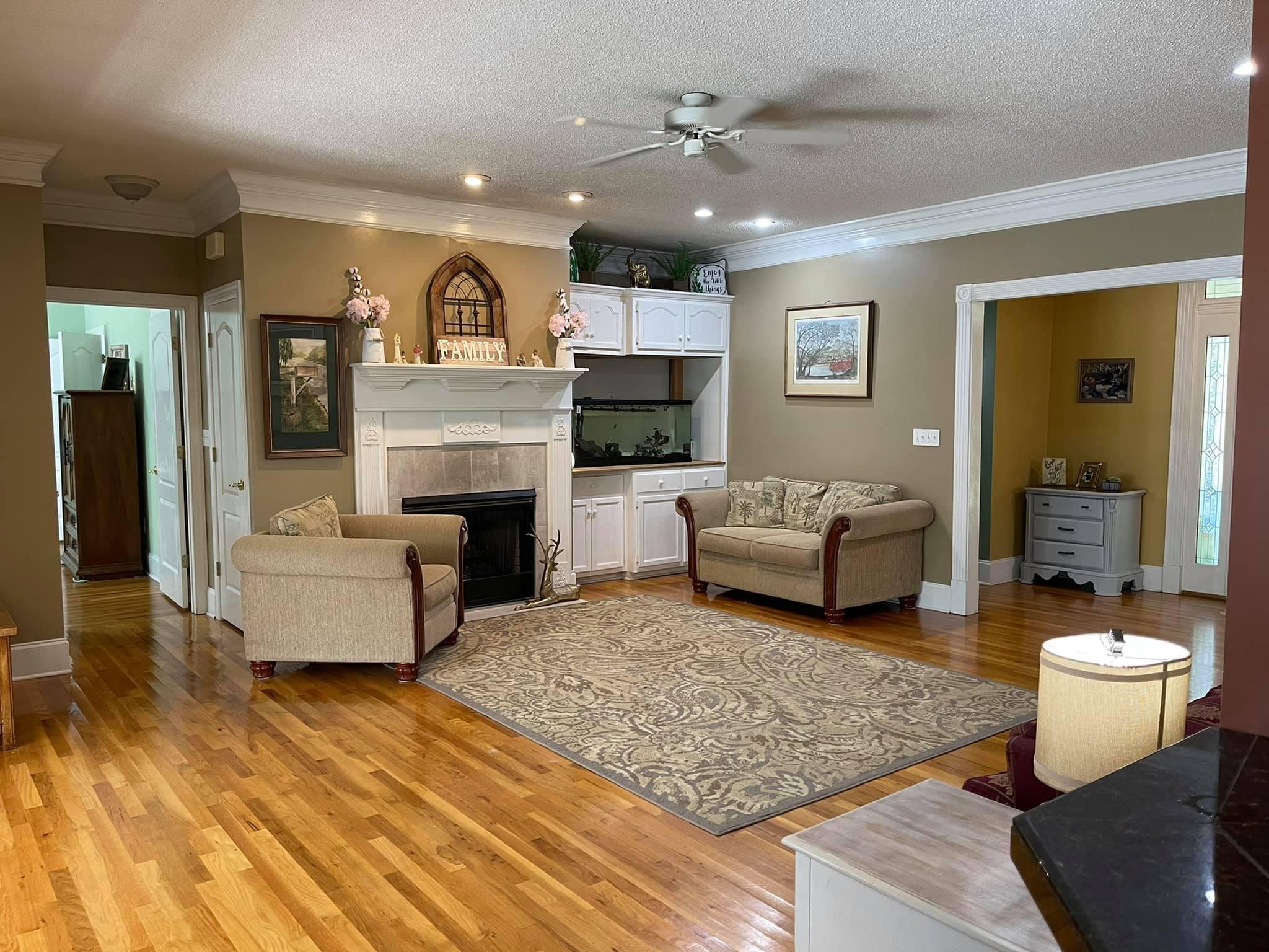 21127 Benvalen Road Andalusia, AL 36420 - Photo 3 of 36 a living room with furniture and a fireplace