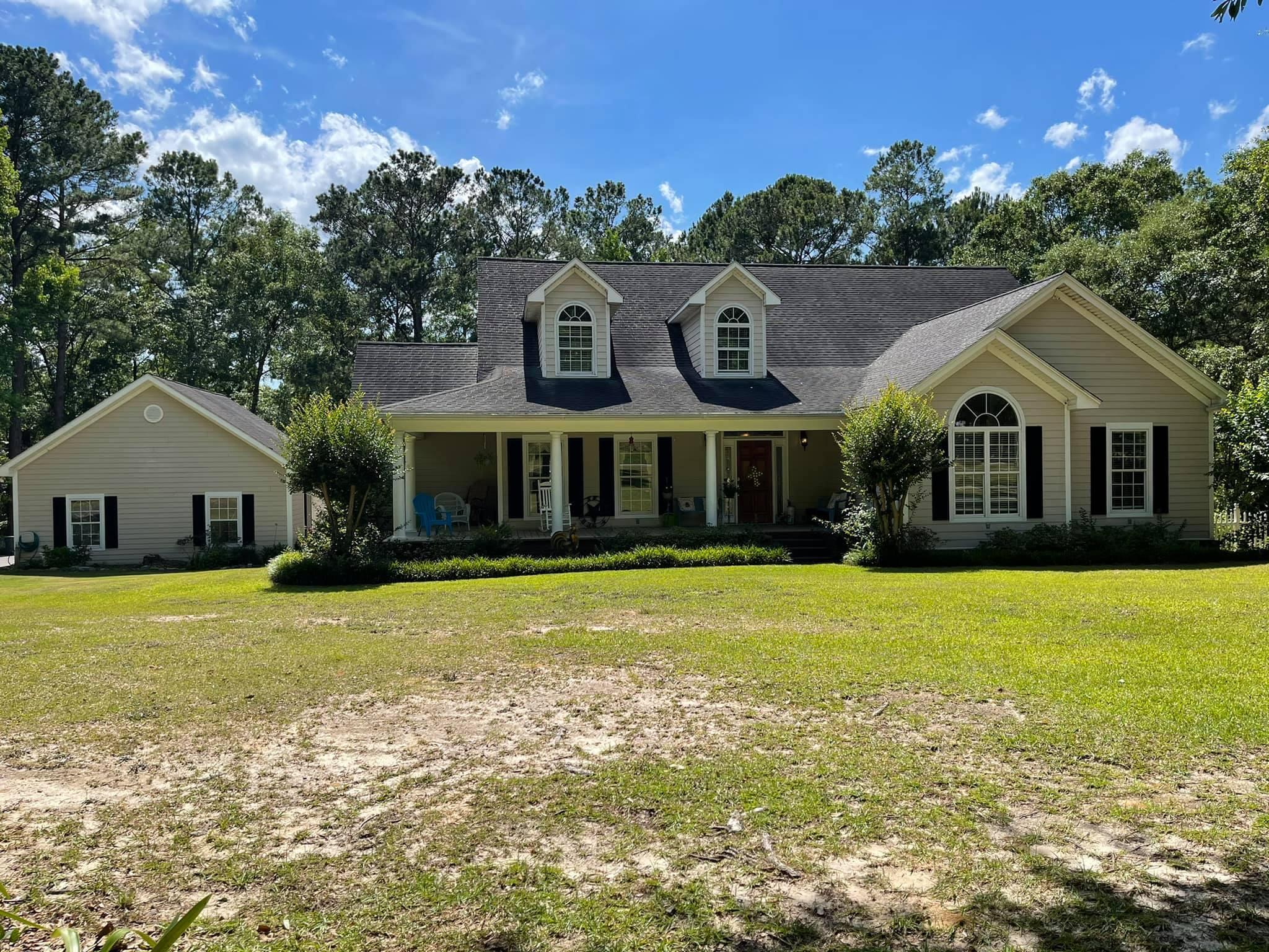 21127 Benvalen Road Andalusia, AL 36420 - Photo 36 of 36 a front view of a house with a yard and garage