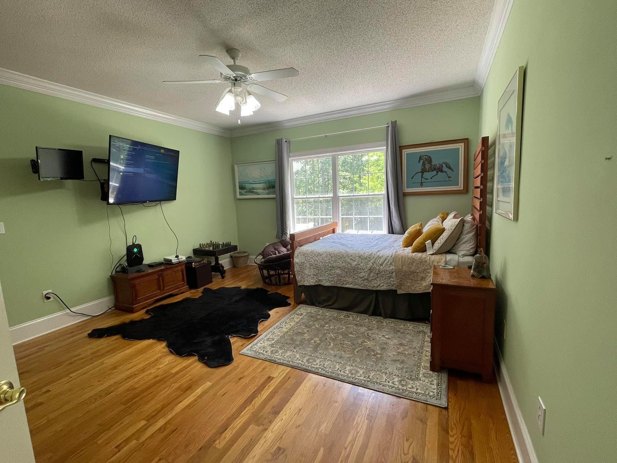 21127 Benvalen Road Andalusia, AL 36420 - Photo 10 of 36 a bedroom with a bed and a flat screen tv