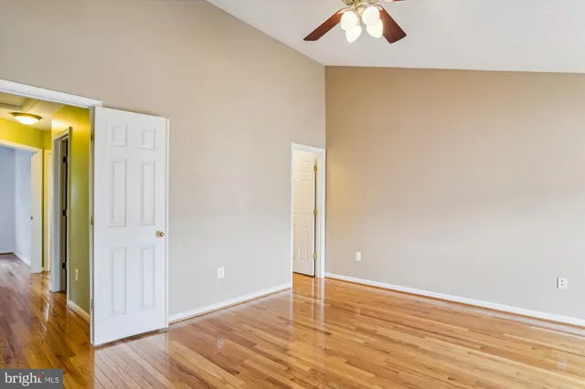 a bathroom with a sink mirror and a bathtub