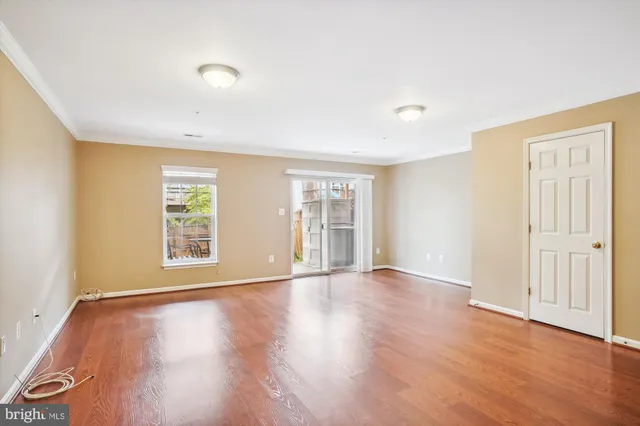a view of a patio with table and chairs and wooden fence