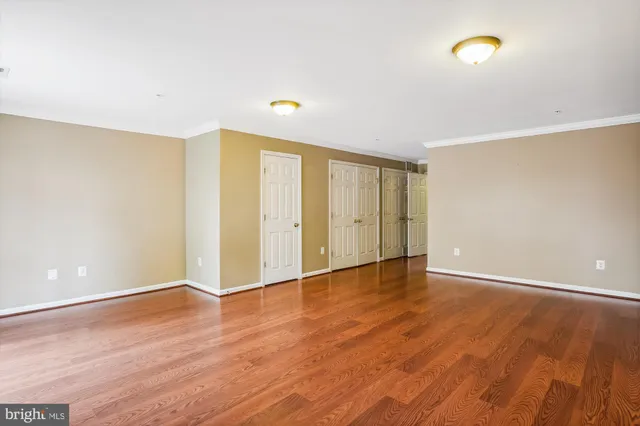 a view of a house with wooden fence