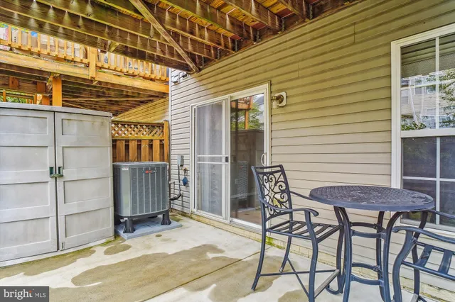 a view of a backyard with wooden fence