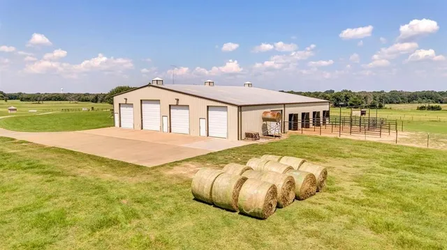 a view of a house with pool and a yard